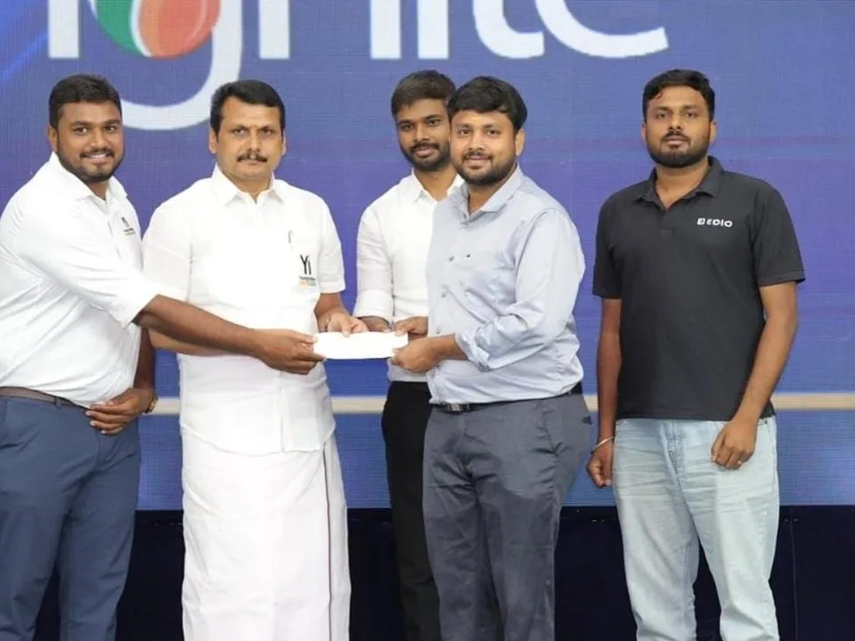 The EDIO team receiving the Best Tech Startup award on stage